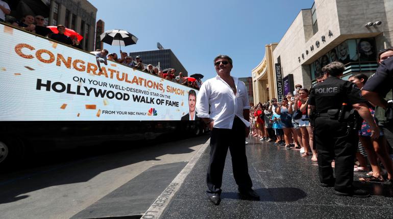 2018-08-22T233302Z_1_LYNXNPEE7L1OA_RTROPTP_4_PEOPLE-SIMON-COWELL-STAR.JPG
